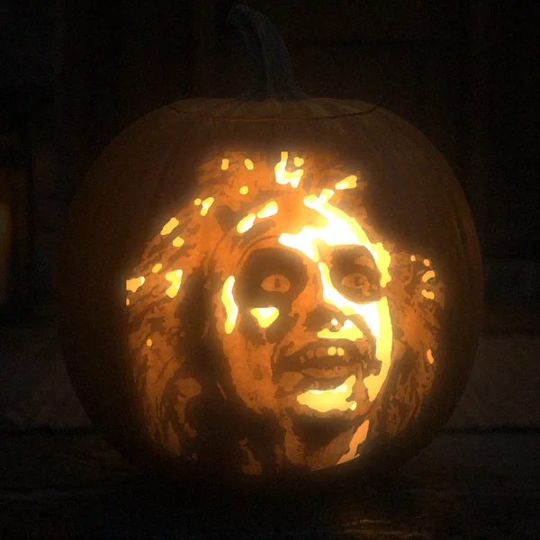 Beetlejuice carved into a glowing pumpkin