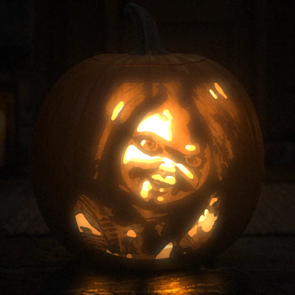 Chucky carved into a glowing pumpkin