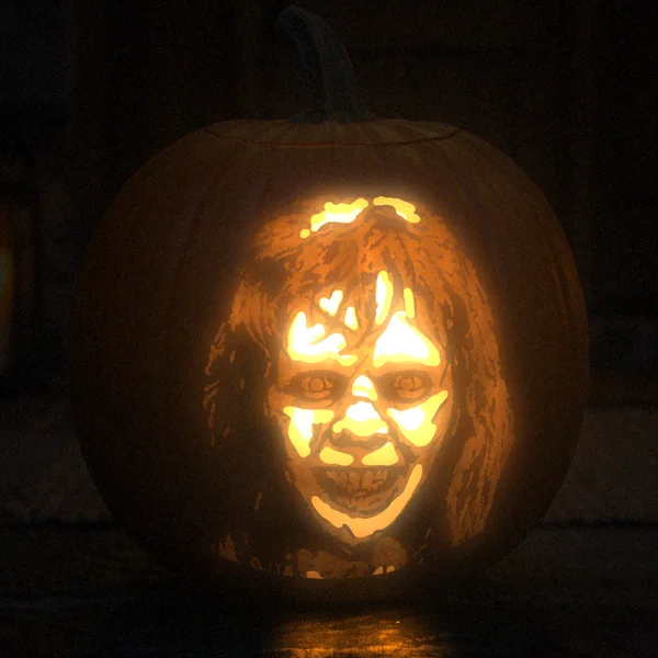 The Exorcist carved into a glowing pumpkin