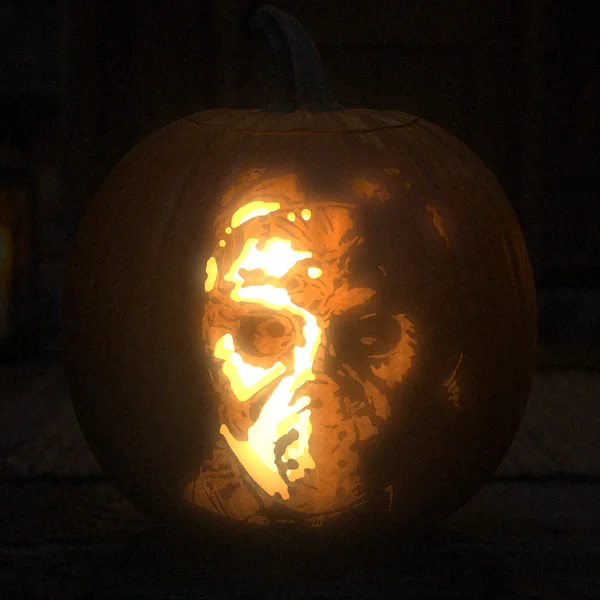 Jason Voorhees carved into a glowing pumpkin
