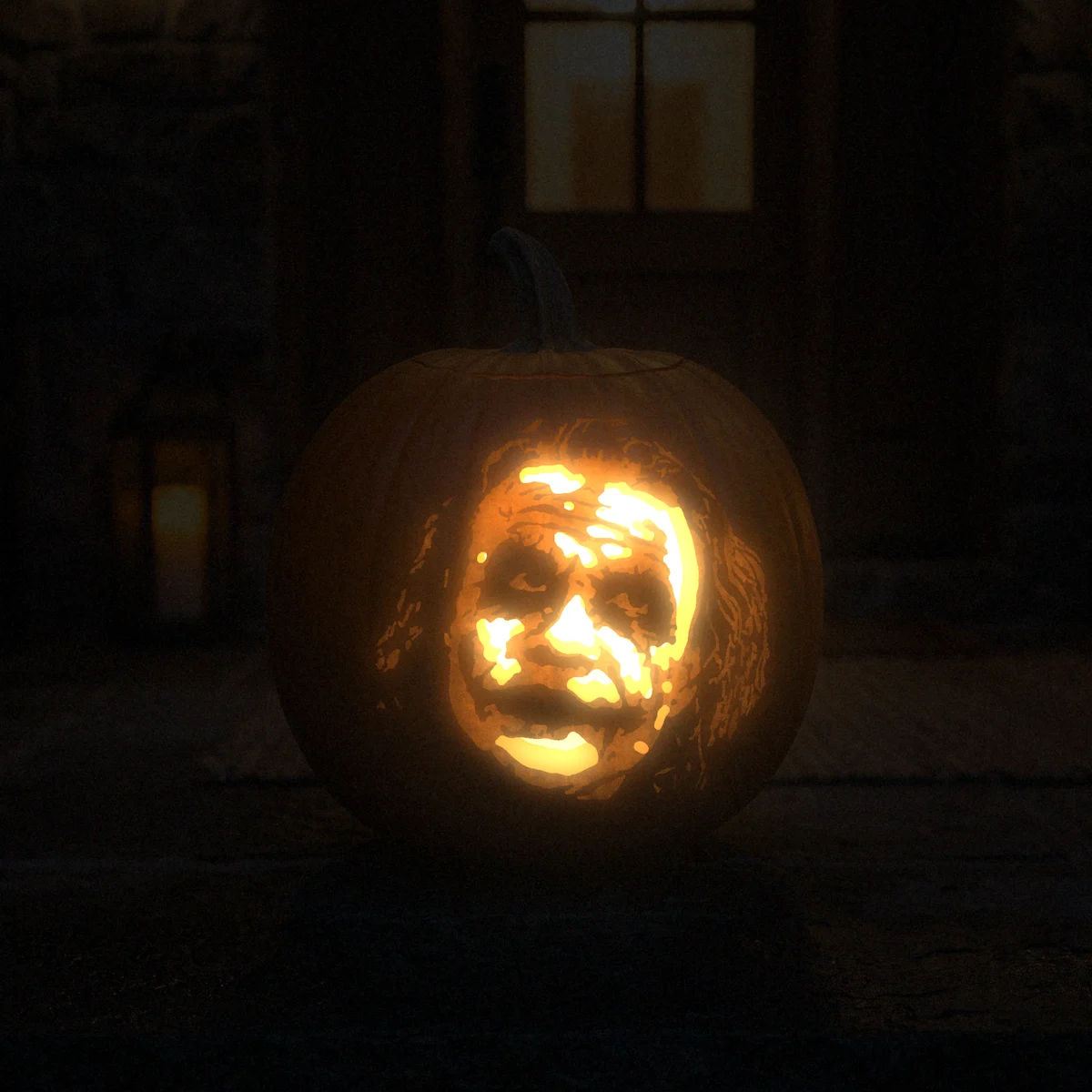 The Joker carved into a pumpkin and lit on a doorstep at night